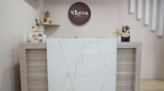 A reception desk with a sleek white marble top in a professional clinic in laser treatments for skin