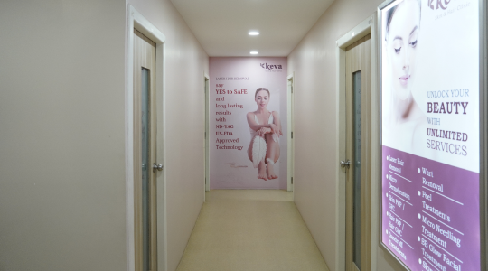 Inside the premises of a skin and hair care clinic with posters explaining the benefits of treatments